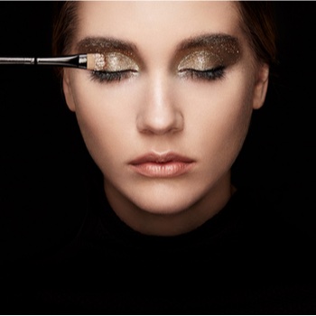 applying eyeshadow Jane Iredale makeup 
